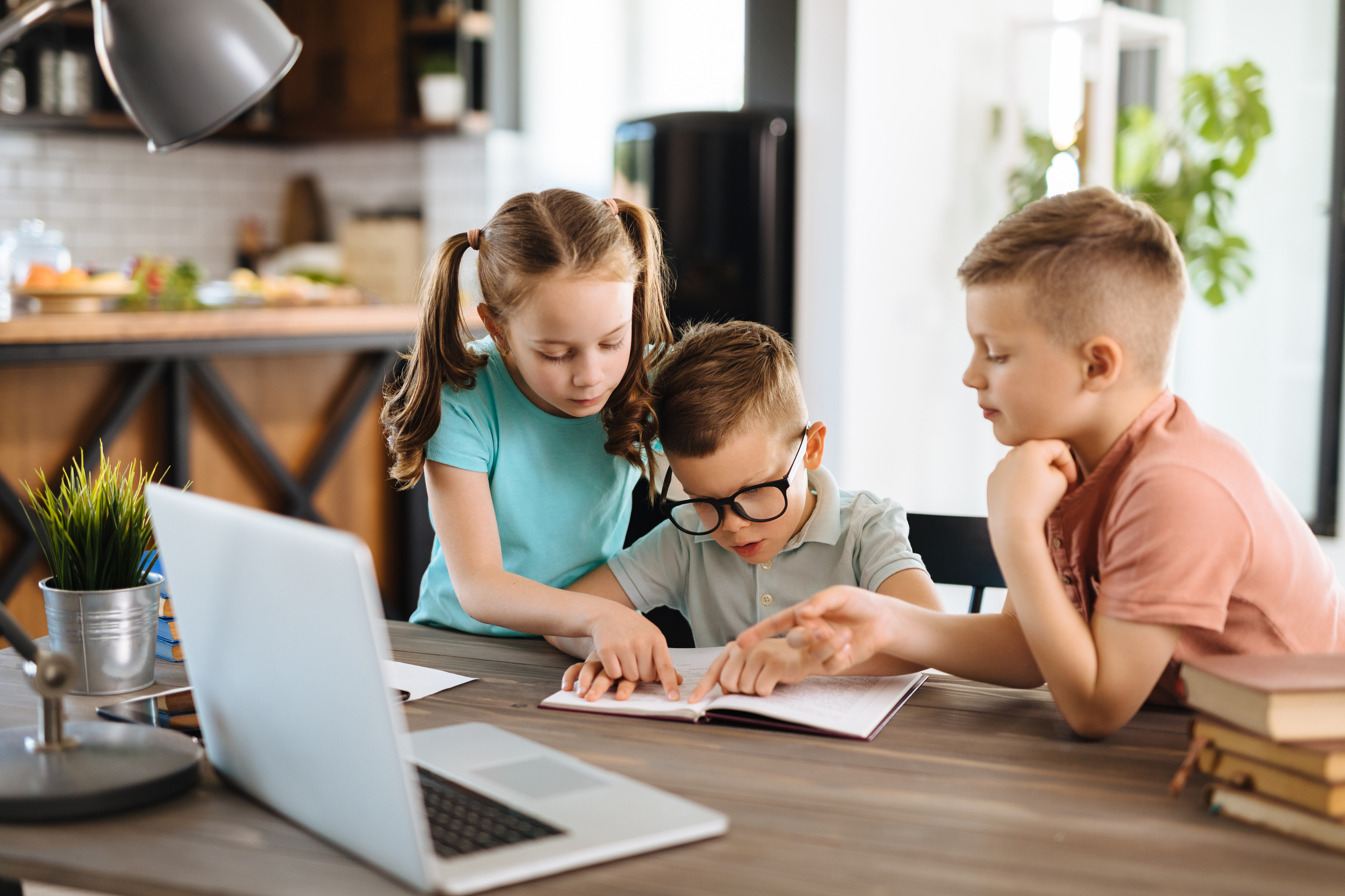 Children using laptop for online learning