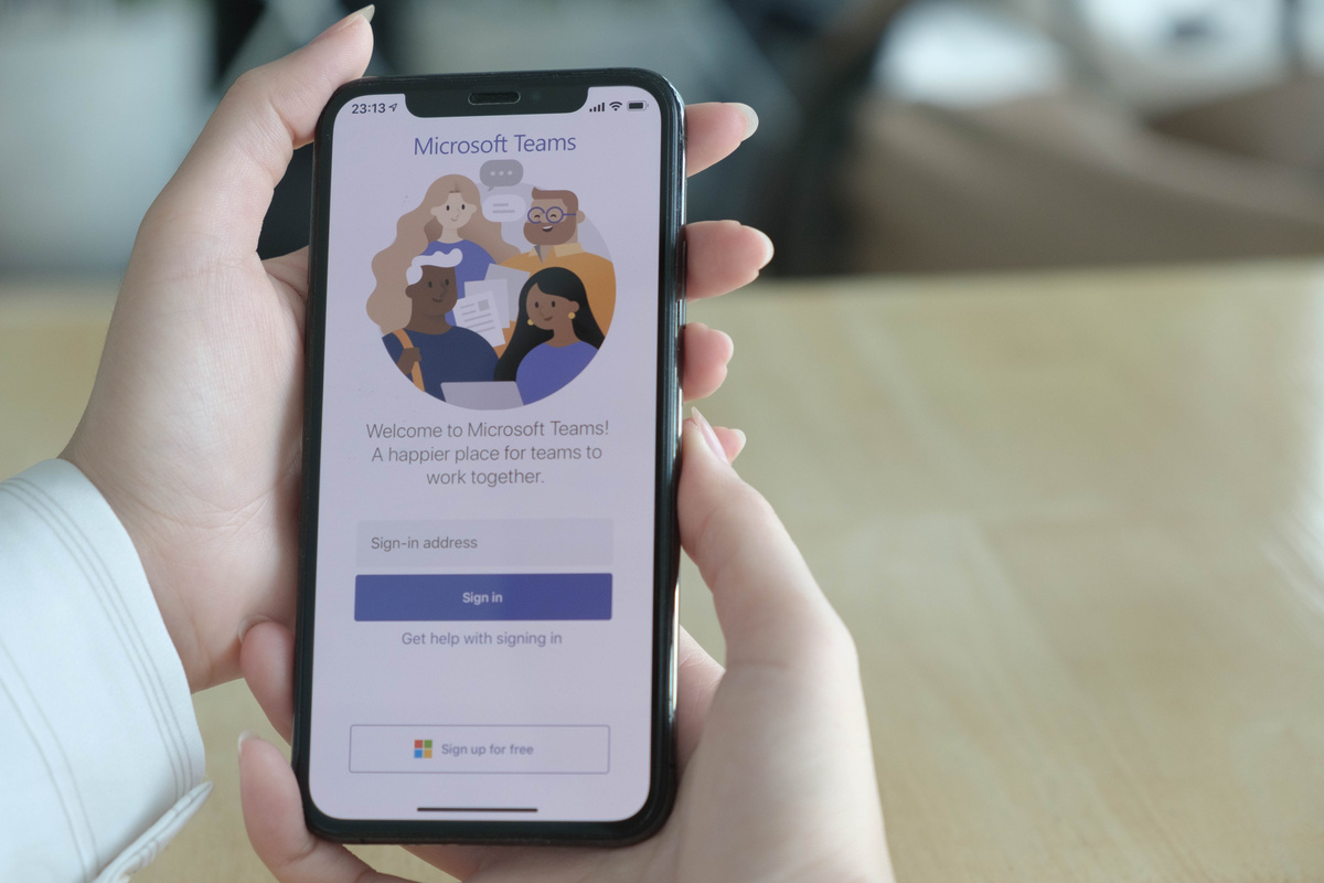 Person Using Microsoft Teams on Smartphone 